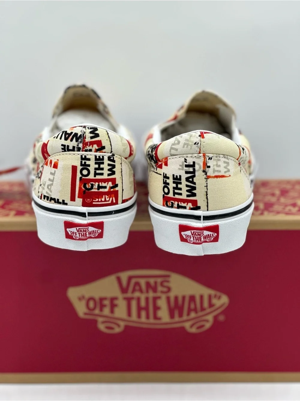 Vans Slip-On Sneakers in Cream, Red & Black Graphic Print